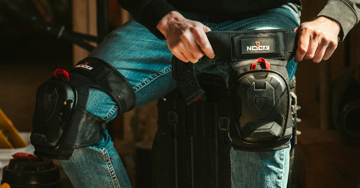 Fit guide: measuring mid-thigh over work pants, two ranges shown: Standard [range] and Large [range].