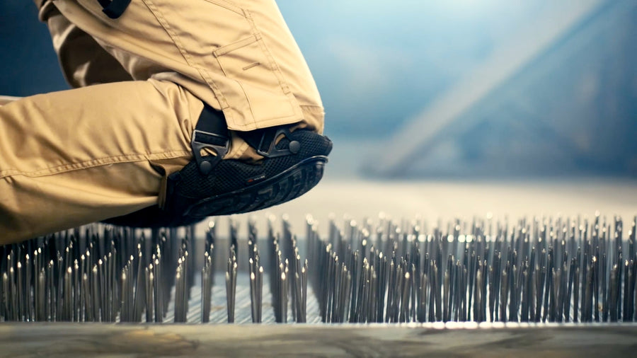 KneeGuard pads kneeling on rubble, scrap metal, broken glass, a bed of nails and burning coals.